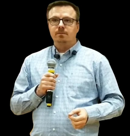 Christopher Scott speaking at a town hall